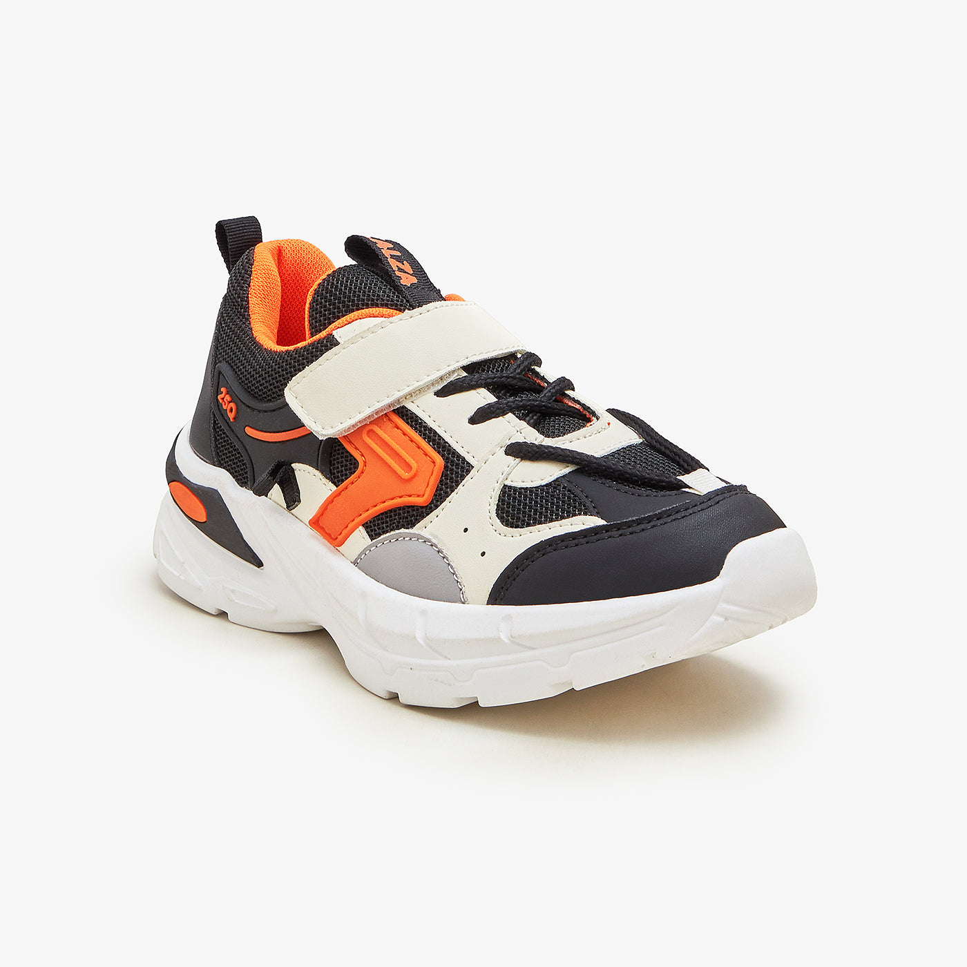 A pair of boys' sporty mesh sneakers with orange and black accents, featuring a lace-up closure and a thick white sole.